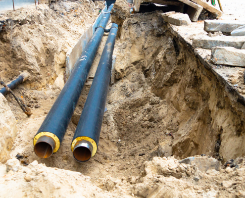 Industrial Pipe Being Installed Underground With View Of Lining